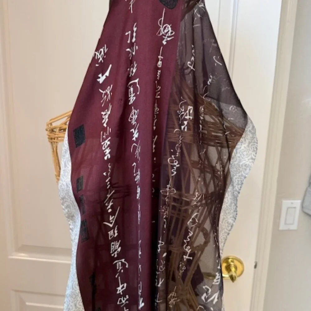 100% silk wine colored and silver oblong scarf.